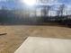 Spacious backyard with a large concrete slab at 110 Sawtooth Oak Ln, Youngsville, NC 27596