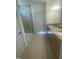 Double vanity bathroom with granite countertop and walk-in shower at 110 Sawtooth Oak Ln, Youngsville, NC 27596