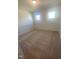 Bright bedroom featuring neutral carpeting and wainscoting at 110 Sawtooth Oak Ln, Youngsville, NC 27596