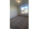 Spacious bedroom with neutral carpeting and large window at 110 Sawtooth Oak Ln, Youngsville, NC 27596
