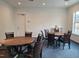 Community room with two round tables and chairs at 110 Sawtooth Oak Ln, Youngsville, NC 27596