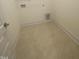 Laundry room with tile flooring and built-in shelving at 110 Sawtooth Oak Ln, Youngsville, NC 27596