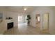 Bright living room with fireplace, hardwood floors, and sliding glass doors at 11331 Involute Pl # 100, Raleigh, NC 27617