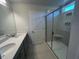 Bathroom with a walk-in shower and tile surround at 30 Calabria Ct, Franklinton, NC 27525
