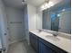 Double vanity bathroom with a large mirror and tile flooring at 30 Calabria Ct, Franklinton, NC 27525