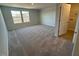 Bright bedroom featuring neutral walls and carpeted floors at 30 Calabria Ct, Franklinton, NC 27525