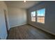 Bright bedroom with hardwood floors and large windows at 30 Calabria Ct, Franklinton, NC 27525