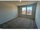 Bedroom with two windows and neutral wall colors at 30 Calabria Ct, Franklinton, NC 27525