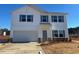 Two-story house with attached garage and large windows at 30 Calabria Ct, Franklinton, NC 27525