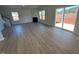 Bright living room with hardwood floors, fireplace and sliding doors at 30 Calabria Ct, Franklinton, NC 27525
