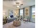 Comfortable living room with gray sofa and wicker coffee table at 30 Calabria Ct, Franklinton, NC 27525