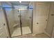 Walk-in shower with tiled walls and a corner seat at 30 Calabria Ct, Franklinton, NC 27525