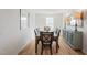 Elegant dining room with a modern light fixture, dining table, and buffet, ideal for Gathering gatherings at 600 Mathiola Dr, Wendell, NC 27591