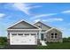 Two-story house with gray siding, stone accents, and a two-car garage at 600 Mathiola Dr, Wendell, NC 27591