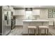 Modern kitchen with white cabinets, stainless steel appliances, and an island at 600 Mathiola Dr, Wendell, NC 27591