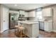 Modern kitchen with white cabinets, stainless steel appliances, and an island at 600 Mathiola Dr, Wendell, NC 27591