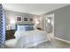 Spacious bedroom with a king-size bed, blue accents, and en-suite bathroom at 600 Mathiola Dr, Wendell, NC 27591