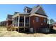 The exterior of a brick house with a screened porch, offering privacy and enjoyment of outdoor space at 7575 Sweetwater Dr, Nashville, NC 27856