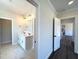 A modern bathroom features dual sinks, stylish lighting, and a spacious walk-in closet at 7575 Sweetwater Dr, Nashville, NC 27856