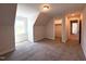 Bedroom featuring closet, carpet, and natural light from window at 7575 Sweetwater Dr, Nashville, NC 27856