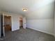 Bedroom with closet featuring neutral walls, carpet, and ample natural light at 7575 Sweetwater Dr, Nashville, NC 27856