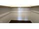 Walk-in closet including carpeted floors, hanging rack, and neutral colored walls at 7575 Sweetwater Dr, Nashville, NC 27856