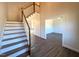Inviting foyer with hardwood floors and a staircase leading to the upper level at 7575 Sweetwater Dr, Nashville, NC 27856