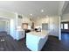 Bright kitchen features white cabinets, large island with sink, and stainless steel appliances at 7575 Sweetwater Dr, Nashville, NC 27856