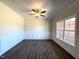 Elegant living room with hardwood floors, wainscoting, and a ceiling fan at 7575 Sweetwater Dr, Nashville, NC 27856