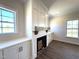 Living room with cozy fireplace framed by built-in cabinets and bright windows at 7575 Sweetwater Dr, Nashville, NC 27856