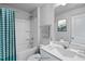 Bathroom with tub, vanity, and teal shower curtain at 8816 Melvin St # 15, Willow Springs, NC 27592