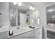 Modern bathroom with double vanity and a shower at 8816 Melvin St # 15, Willow Springs, NC 27592