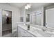 Double vanity bathroom with walk-in shower and closet at 8816 Melvin St # 15, Willow Springs, NC 27592