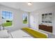 Bedroom with two windows and double doors at 8816 Melvin St # 15, Willow Springs, NC 27592