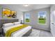Bedroom with two windows and wood-like bed at 8816 Melvin St # 15, Willow Springs, NC 27592