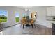 Bright dining area with wood table and chairs, view to backyard at 8816 Melvin St # 15, Willow Springs, NC 27592