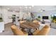 Open concept dining area with kitchen and living room views at 8816 Melvin St # 15, Willow Springs, NC 27592