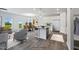 Open concept kitchen with white cabinets, stainless steel appliances, and an island with seating at 8816 Melvin St # 15, Willow Springs, NC 27592