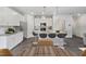 Modern kitchen with white cabinets, granite countertops, and island at 8816 Melvin St # 15, Willow Springs, NC 27592