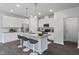 Modern kitchen with white cabinets, granite countertops, and stainless steel appliances at 8816 Melvin St # 15, Willow Springs, NC 27592