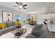 Spacious living room with gray sofa and view to backyard at 8816 Melvin St # 15, Willow Springs, NC 27592