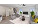 Living room with gray couches, coffee table, and large windows at 8816 Melvin St # 15, Willow Springs, NC 27592