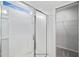 Bright shower featuring glass doors and tile walls, next to an open closet at 8816 Melvin St # 15, Willow Springs, NC 27592