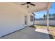 Covered back patio with ceiling fan offers a relaxing outdoor space next to a private backyard at 91 Laramie Ln, Selma, NC 27576