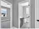 Stylish half-bathroom with a modern vanity, sleek fixtures, and a coordinating mirror, accessible from the hallway at 91 Laramie Ln, Selma, NC 27576