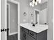Modern bathroom vanity features a stylish countertop and a large mirror with modern lights to enhance the space at 91 Laramie Ln, Selma, NC 27576
