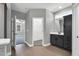 Bathroom features tile flooring, a walk-in closet, and modern vanity at 91 Laramie Ln, Selma, NC 27576