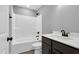 Bathroom featuring a shower-tub combo, modern vanity, bronze fixtures, and neutral walls at 91 Laramie Ln, Selma, NC 27576