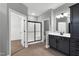 Bathroom has tile flooring, walk-in closet, glass shower, and vanity at 91 Laramie Ln, Selma, NC 27576