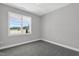 Bedroom with a large window, carpeted floor, and a neutral color scheme provides a bright and cozy living space at 91 Laramie Ln, Selma, NC 27576